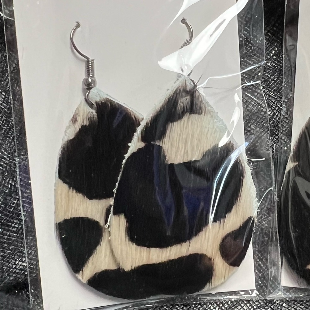 Hair on, rawhide, genuine Leather teardrop earrings 1.5” x 2.25” Handmade. Brown